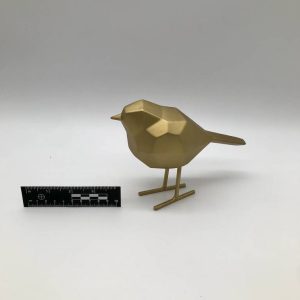 Geometryczna figurka ptaka low-poly złoty metal